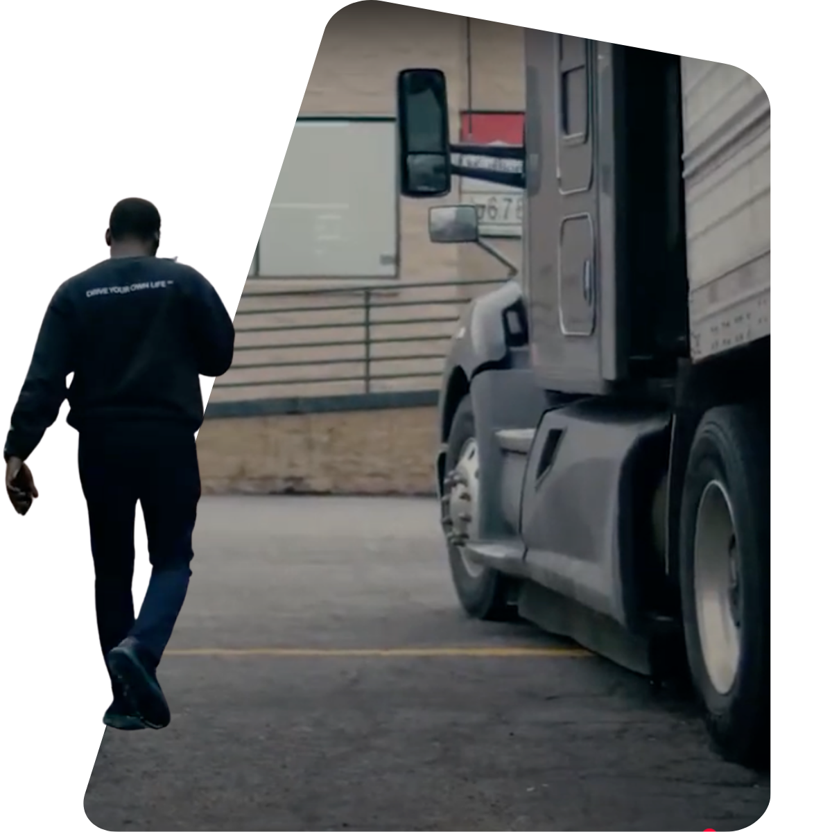 Professional trucker walking towards semi-truck in industrial setting